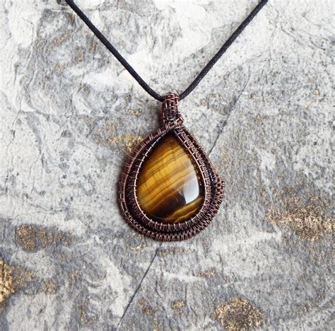 Amplify your intentions with the magic of a tiger eye pendant